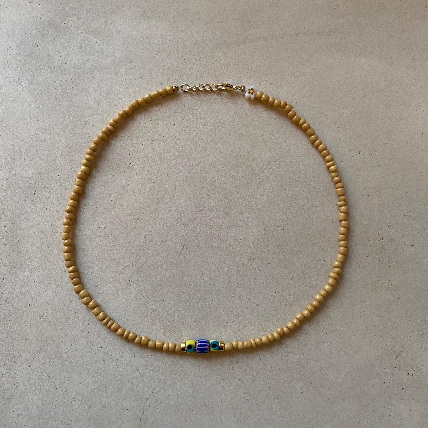 Yellow eye beaded necklace